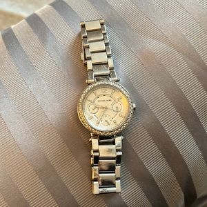Women’s Silver Michael Kors watch with rhinestone detail in/around watch face